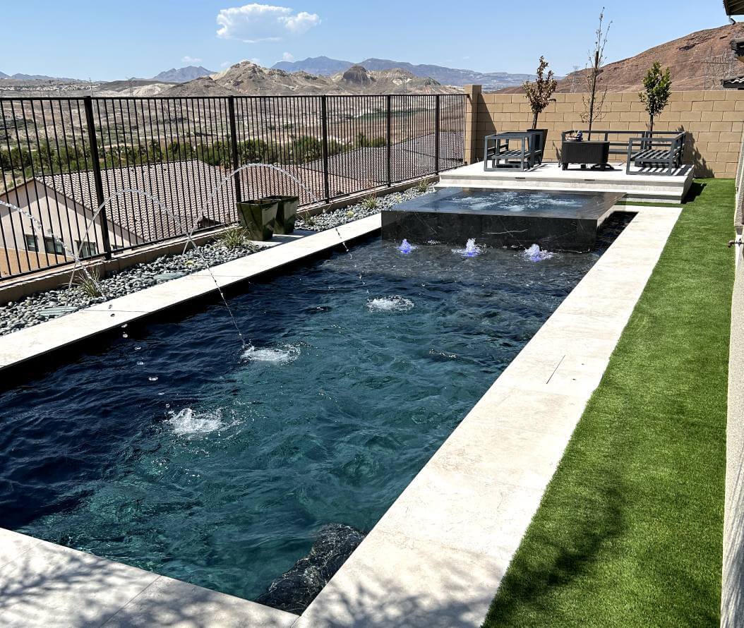 Long rectangular pool. Mountains in the background.