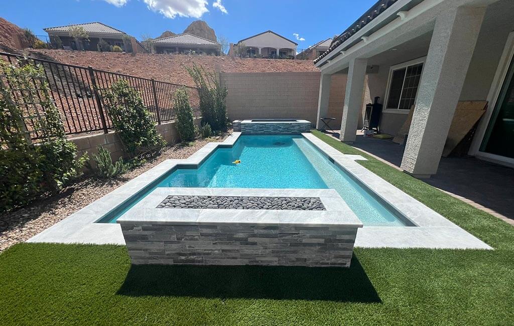 Stone bench overlooking swimming pool